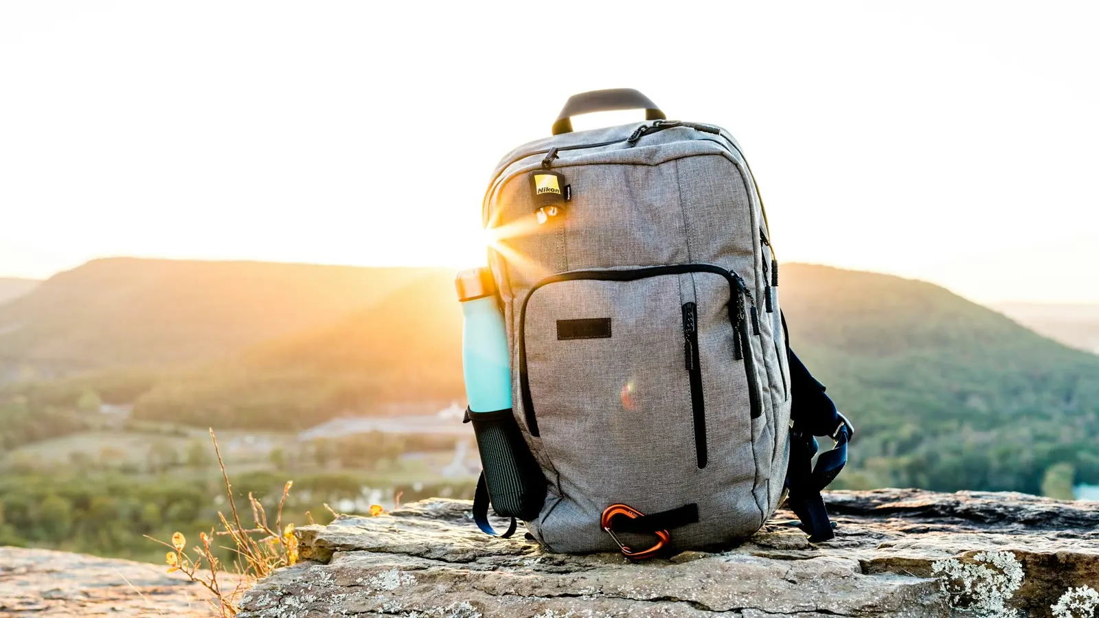 A travel backpack ready beside a mountain view