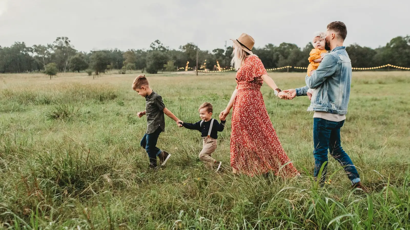 A family walking together through an open field